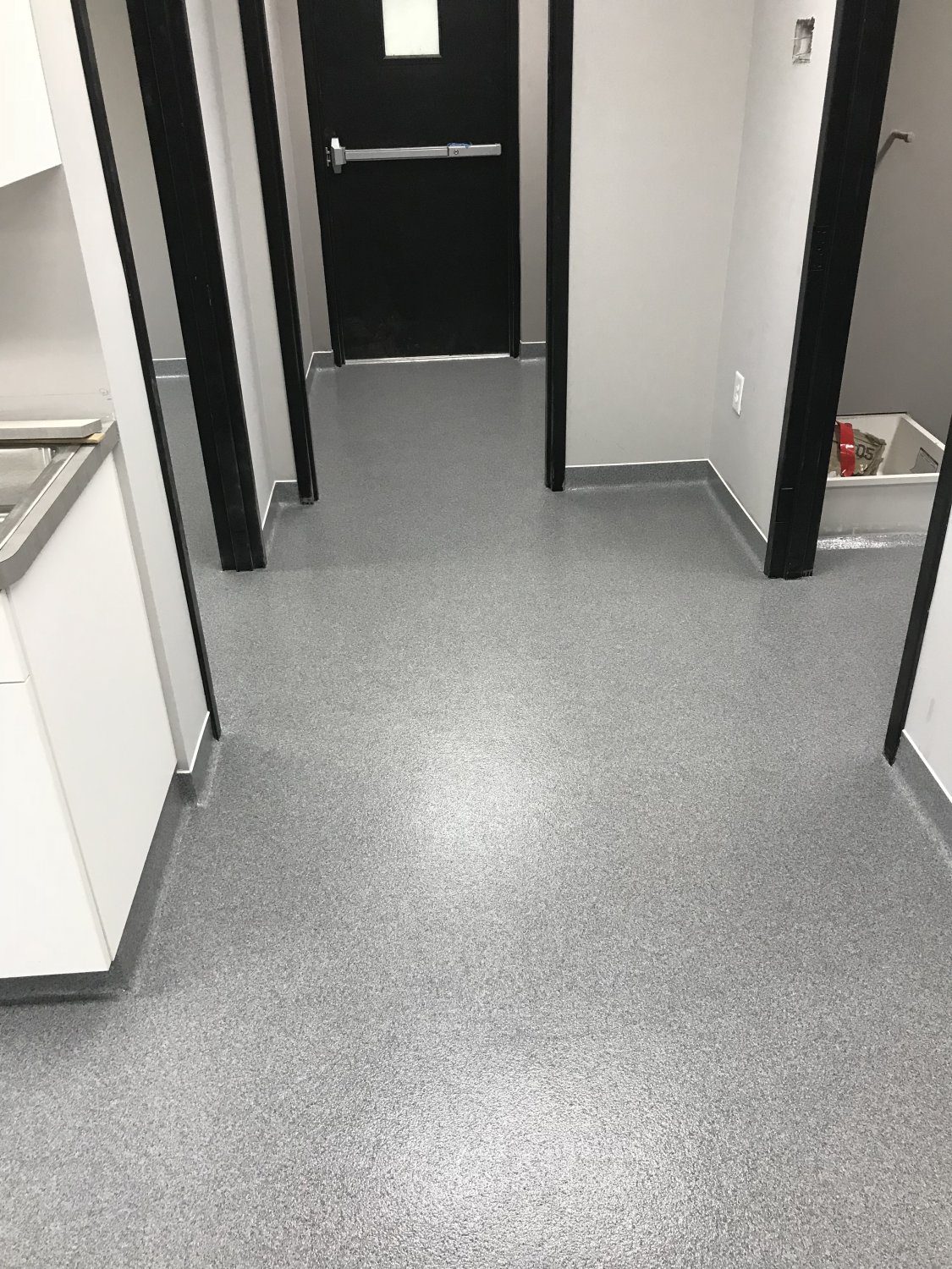 Industrial hallway with gray flooring
